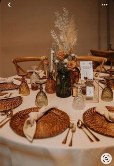 the table is set with place settings for dinner