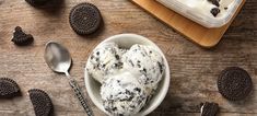 an ice cream dish with oreo cookies on the side