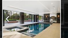 an indoor swimming pool in the middle of a house