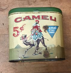 an old metal can with a camel on it