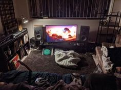 a living room filled with furniture and a flat screen tv