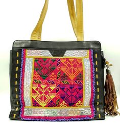 "Walk on the wild side with this gorgeous clean new Banjara embroidered leather shoulder bag from India. One of a kind! Stunning design, hand embroidered using vintage village textiles from the Banjara tribes of western India. Adorned with bead work, tassels. Banjara works are among the world's most attractive textiles - the colors, the stitches, the patterns, and their dazzling embellishments. This incredible beauty is created amidst very frugal lives. Banjara fabrics are highly collected. Own Traditional Black Travel Bag, Traditional Black Rectangular Bag, Traditional Black Rectangular Shoulder Bag, Traditional Black Tote Shoulder Bag, Traditional Black Tote Bag, Daily Use Hand-stitched Tote Shoulder Bag, Hand-stitched Tote Shoulder Bag For Daily Use, Daily Use Tote Shoulder Bag, Hand-stitched, Bohemian Black Square Shoulder Bag