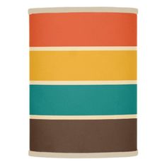 a lamp shade with multi colored stripes on it