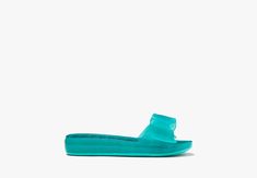 Whether you're lounging by the pool or beach our new slide sandals will keep you looking polished. | Kate Spade Tie The Knot Slide Sandals, Clean Green - 7 Green Slides For Summer Beach, Spring Slip-on Pool Sandals, Spring Pool Sandals Slip-on, Spring Slip-on Sandals For Pool, Spring Season Slip-on Pool Sandals, Summer Synthetic Slides For Poolside, Synthetic Slides For Summer Poolside, Spring Pool-ready Slip-on Sandals, Synthetic Slides For Poolside Summer