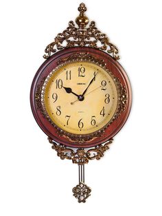 an ornate clock is hanging on the wall