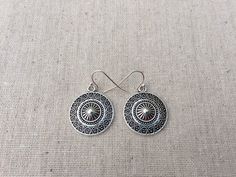 "These are unique and highly detailed boho disc earrings. They have a unique eye catching design and would be perfect for everyday wear. They measure 7/8\" across by 1\" long and hang from simple elegant ear wires. The earrings are made from allergy free plated silver. I have a matching necklace in my shop, if you would like the whole set. Here is the link https://etsy.me/2X6CB2r Thanks for stopping by. Please take a moment and visit the rest of my shop. I have many more unique jewelry designs t Adjustable Drop Earrings With Sun Design, Bohemian Sun Design Adjustable Earrings, Vintage Round Earrings For Festivals, Round Festival Earrings, Southwestern Metal Earrings For Gift, Southwestern Style Metal Earrings For Gift, Southwestern Style Festival Earrings, Southwestern Style Round Festival Earrings, Bohemian Circle Earrings With Ear Wire