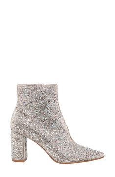 Instantly elevate any outfit with these fabulous pointy toe booties covered in a symphony of glittering crystals. 3 1/5" heel 5 1/5" shaft height Side zip closure Rhinestone and textile upper/textile lining/synthetic sole Imported Elegant Sparkling Boots For Night Out, Elegant Sparkling Boots For Fall, Sparkling High Heel Evening Boots, Glamorous High Heel Boots With Glitter, Embellished Evening Boots For Party Season, Glamorous Embellished Evening Boots, Glamorous Sparkling Crystal Heels, Glamorous Evening Embellished Boots, Glamorous Glitter Ankle Boots