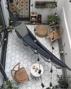 an overhead view of a patio with tables and chairs