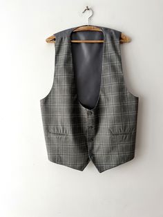 "Vintage Grey plaid Gentleman's Formal Fitted Waistcoat Grey checkered Groom Steampunk Classic Mens Vest Office Mens Vest Size Large to XL Label size: 56 Estimated size: L/XL Measurements:  (lying flat): Length: 24.5\"/ 62 cm *Pit to pit: 21.5\"/ 54.5 cm *Waist: 22\"/ 55.7 cm * measurements taken while garment lay flat, to get girth you need to double measurements. Please check measurements to insure a proper fit. Remember to allow yourself some extra room for movement. You can compare these with something from your closet that fits you well. This vest will come to you freshly laundered and ready to wear. Please feel free contact me if you need additional measurements or have any questions Condition: great Vintage Condition SHIPPING * I ship worldwide via Priority mail (Latvijas Pasts) fro Fitted Plaid Vest For Winter, Fitted Waistcoat, Plaid Suit, Grey Plaid, Vest Outfits, Suit Vest, Extra Room, Mens Vest, Lay Flat