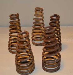 there are four different types of springs on the table together, and one is brown