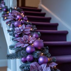 purple christmas decorations are lined up on the stairs