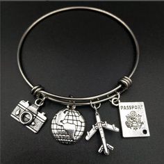 Brand New Travel Charm Silver Bangle Bracelet. Charms Included Passport, Camera, Airplane And Globe World Traveler Bracelet Love Of Exploring, Adventure Explorers Travel Bracelet Great Gift For The World Traveler Or Yourself Adjustable Silver Jewelry For Travel, Silver Metal Jewelry For Travel, Travel Charm Bracelet, Travel Bracelet, Travel Inspired Jewelry, Wall Pics, Travel Charms, Wire Bangles, Love Travel