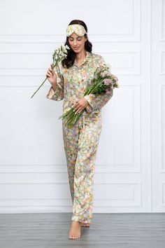 Flowers aren't just for spring and summer, but these silk pajamas provide a cheerful pop of color to complement every season. Ease into the day in pajamas that are floral to the core. Made from beautifully soft silk, this printed pair of PJs is as versatile as it is colorful. Look closely and you'll see a canvas of blooms, and stems just waiting for you to explore. *Sleep Eye Mask not included Feminine Floral Print Sleepwear For Pajama Party, Spring Floral Print Sleepwear, Spring Floral Print Sleepwear For Relaxation, Silk Pajamas Set, Spring Floral Print Multicolor Sleepwear, Sleep Eye, Silk Pajama Set, Multicolor Floral Print V-neck Sleepwear, Romantic Evening