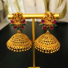 Matte Gold Pearl Jhumka/ Bollywood Jhumka Earrings/ Kemp Stone South Indian Jewelry/ Temple Jewelry/ Traditional Indian Ethnic Jewelry Features: Made in Brass with 22 Karat Gold plating Ethnic Temple Jewelry Jhumka Earrings Length: Approx. 2 Inches This pair of earring is made in Gold finish with Semi precious stone beads Comes with Push back closure Suitable for Indian traditional Attire depending upon the occasion and the theme. Very lightweight, hand carved earrings Festive Peacock Design Jhumkas For Rituals, Navratri Festive Earrings With Peacock Design, Temple Jewelry Style Jhumkas With Latkans For Festivals, Temple Jewelry Jhumkas With Latkans For Festivals, Temple Jewelry Jhumkas For Festivals And Celebrations, Heavy Jhumkas For Rituals And Festivals, Temple Style Jhumkas For Festivals, Diwali Celebration Temple Jewelry Jhumkas, Round Earrings For Rituals And Festivals