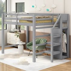 a loft bed with stairs and desk underneath it