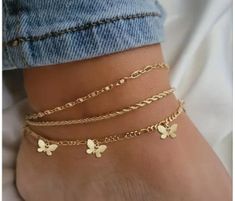 Enhance your summer style with our Set of 3 Simple Butterfly Charm Layered Beach Anklets. This charming collection features three anklets, one adorned with delicate butterfly charms. Perfect for layering, these anklets add a touch of elegance and whimsy to any beach outfit. Crafted with care, they offer both durability and style, making them an essential accessory for your seaside adventures. Whether you're strolling along the shore or enjoying a casual day out, these anklets will beautifully complement your look. Gold Anklets As Spring Gift, Trendy Anklets For Spring Vacation, Gold Casual Anklets For The Beach, Casual Gold Anklets For Beach, Spring Gold Anklets For The Beach, Trendy Anklets For Spring Season Gift, Trendy Spring Anklets Perfect For Gifts, Trendy Spring Gift Anklet, Casual Spring Anklets