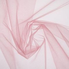 Add a decorative and dainty touch to sewing and craft projects with Dusty Rose Nylon Tulle Fabric. This is perfect for adding to elegant and classic dresses, blouses, and skirts or for using with wedding decor, favors, gift packaging and more. Combine your finished products with beads, buttons and zippers for extra special creations!     Details:   Width: 54"  Weight: Sheer  Country Of Origin: Mexico  Content: 100% Nylon  Care: Machine Wash, Warm; Tumble Dry, Remove Promptly.      Available in 1 Saying And Quotes, Tulle Skirts, Fabric Roses, Wedding Top, Print Coupons, Soft Tulle, Organza Fabric, Fabric Bolts, Luxury Bridal