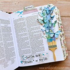 an open bible with butterflies on it and the words god can work in my life