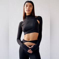 Urban Outfitters Two Piece Bombshell Cutout Cropped Top And Pant Set. Size Small Long Sleeve Cropped Top And Pant Set From Uo With Cutout Detailing Throughout. Top Is Super Fitted With A Turtleneck Plus A Cropped Bodice And Cutouts At The Back And Front. Finished With Thumbholes At The Cuffs. Pants Are Cut With A High-Rise And Fitted Throughout With A Cutout At The Front And Complete With Split Hems. Features: -Matching Top And Pants From Uo With Keyholes Cutouts Throughout -Top Hits Above The W Black Elastane Crop Top For Fall, Versatile Fitted Black Crop Top, Versatile Black Stretch Crop Top, Versatile High Stretch Black Crop Top, High Stretch Chic Black Crop Top, Chic Black Elastane Crop Top, Versatile Black Crop Top For Night Out, Fitted Crop Top By Urban Outfitters For Night Out, Chic Black Stretch Crop Top