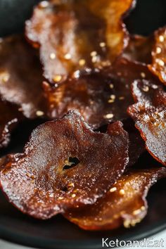 some kind of food that is sitting on a black plate with gold flecks