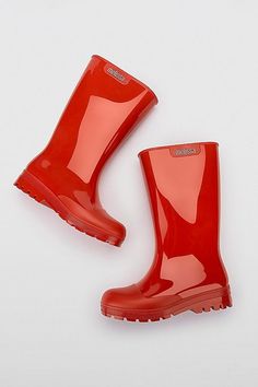 Welly is Melissa's rain boot that guarantees a lot of style. Waterproof with tuttifrutti smell, it is perfect to use during the rainy days, in the cold, or any other ocaison. Melissa's Welly is made with Melflex and it is recycable and sustaintable. Content+Care 100% PVC Vegan certified 100% recyclable Water resistant Signature melissa tutti frutti scent Made in Brazil Hand wash with warm water and mild soap Air dry away from the sun Size+Fit True to size Foot Height - 4.65 in. Foot Length - 9.53 in. Foot Width - 3.72 in. | Melissa Jelly Rain Boot in Red, Women's at Urban Outfitters Red Rain Boots, Wellies Rain Boots, Red Shades, Rain Shoes, Plastic Shoes, Red Fits, Red Boots, Rain Boot, Tutti Frutti