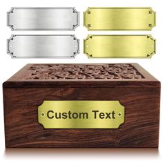 a wooden box with two metal plates on top and the words custom text below it