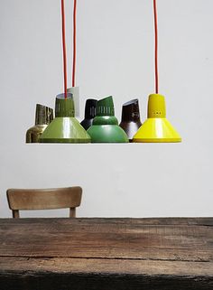 a wooden table topped with lots of different colored lights hanging from it's sides