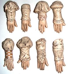 an assortment of carved hand and wrist pieces