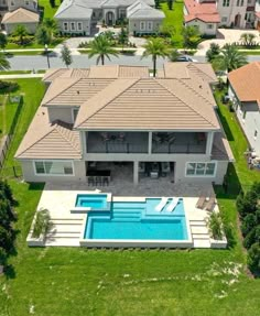 an aerial view of a house with a swimming pool