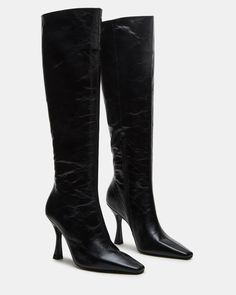 Expertly crafted, the FAYE knee-high heeled boot features an inside zipper for easy wear. This boot offers both style and functionality. Stay on trend and comfortable with this must-have addition to your wardrobe. 3.75 inch heel height Size 6 measurements: 14.5 inch shaft circumference, 14.75 inch shaft height Size 8 measurements: 15.5 inch shaft circumference, 15 inch shaft height Size 10 measurements: 16.5 inch shaft circumference, 15.5 inch shaft height Leather upper material Textile and synt Black Over-the-knee Boots With Zipper Closure, High Ankle Heeled Boots With Zipper For Night Out, Fitted Faux Leather Knee-high Boots With Zipper, Wide Calf Knee-high Boots For Party, Chic Knee-high Boots In Faux Leather, Knee-high Boots With Zipper Closure, Tall Winter Heeled Boots With Zipper Closure, Pointed Toe Knee-high Boots With Zipper For Fall, Fitted High Heel Knee-high Boots With Zipper