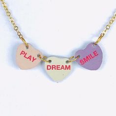 Candy heart necklace on 18” chain. You can’t eat this necklace but at least it won’t leave your neck sticky. Cute Heart Pendant Charm Necklace For Best Friend, Heart-shaped Necklace With Adjustable Chain For Birthday, Trendy Heart Charm Necklaces For Gift, Trendy Personalized Heart Pendant Necklace, Trendy Heart-shaped Charm Necklace Gift, Trendy Heart-shaped Charm Necklaces As Gift, Trendy Heart-shaped Charm Necklace As Gift, Cute Heart Pendant Necklace For Best Friend Gift, Trendy Personalized Heart Pendant Charm Necklace