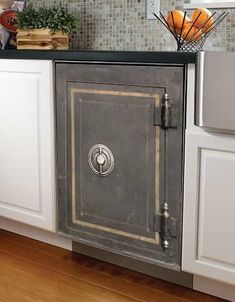 an old metal cabinet in the middle of a kitchen