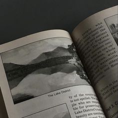 an open book with black and white pictures on it