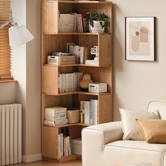 a living room filled with furniture and a book shelf