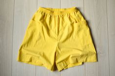 Beautiful summer shorts with two side pockets. Seems like at least partly made of linen, although can't say it for sure, because there is no information about the fabric. Vintage condition on a scale 1-10 is 9 MADE IN U.S.A. Size : marked size (12); seems like women's (M/L) PLEASE CHECK ALL MEASUREMENTS BELLOW: Length: 50 cm / 19.5" Waist: 66-90 cm / 26-35.5" Hips: 120 cm / 47" Inseam: 16 cm / 6.5" Fabric: cotton, linen Brand: Catalina FIND MORE SHORTS AND PANTS HERE: https://www.etsy.com/shop/T Loosely Fitted High Waist Shorts For Summer, Loosely Fitted Beach Shorts With Pockets, Loose Fit Cotton Shorts For Beach, Loosely Fitted Cotton Shorts For The Beach, Loosely Fitted Shorts For Summer, Loosely Fitted Summer Shorts, Yellow Relaxed Fit Shorts For Summer, Relaxed Fit Yellow Shorts For Summer, High Waist Cotton Bermuda Shorts For Beach