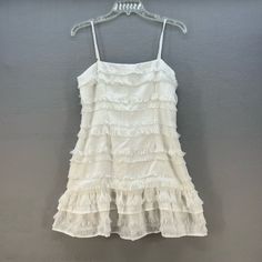 Nwt Princess Polly Women's Molina Mini Dress. This White Mini Dress Is In New With Tag Condition And Is Tagged Size 8. This Strapless Dress Has 'Ruffle' Like Layers And Is Made Out Of 65% Cotton And 35% Polyester. Approximate Measurements (Flat Lay): Armpit To Armpit: 16" Top To Bottom: 31" Waist: 32" Sleeves: Sleeveless Offers Welcome! Fast Shipping 5 Star Seller Tags: Nightclub, Going Out, Southern Bell, Ruffles, Wedding, Date Night, Summer, Spring, Vacation, Festival, Minimal, Neutral, Southe Vintage Cotton Mini Dress With Ruffles, Vintage White Ruffled Mini Dress, White Ruffled Mini Fairy Dress, Sleeveless Coquette Mini Dress With Ruffles, White Princesscore Mini Dress, Polly Dress, Preppy Southern, Casual White Dress, Purple Mini Dresses