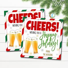 two christmas cards with cheers written on them