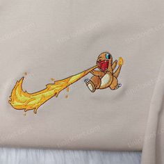 The Nike Swoosh Pokemon Charmander Embroidered Shirt is a must-have for Pokemon fans! With the iconic Charmander embroidered on the Pokemon Fashion, Pokemon Charmander, Anime Sweatshirt, Custom Nike, Disney Sweatshirts, Sports Fashion, Custom Nikes, Anime Hoodie, Embroidered Clothes