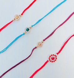 Celebrate the bond of love and protection with our modern, minimalistic handmade rakhis that are perfect for year-round wear! Introducing our exclusive collection of handmade rakhis, crafted with 100% bright colored cotton thread, designed to add a touch of elegance to your Raksha Bandhan celebration. Our rakhis are the perfect blend of tradition and modernity, offering a sleek, non-bulky design that men can comfortably wear all year round. Each rakhi in our collection is a testament to quality and craftsmanship. Customers can choose from four unique designs, each thoughtfully created to symbolize the special bond between siblings. Simply select your preferred design under the variations to make your choice. Why Choose Our Rakhis? - Premium Quality: Made with 100% bright colored cotton thr Round Bracelets Gift For Diwali, Diwali Gift Bracelets, Adjustable Bracelets For Diwali Gift, Adjustable Round Bracelets For Puja, Adjustable Bracelets For Puja, Traditional Jewelry With Sliding Knot For Gifts, Traditional Sliding Knot Jewelry As Gift, Traditional Jewelry With Adjustable Length As Gift, Traditional Jewelry Gift With Adjustable Length