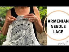 an old woman is holding a piece of crocheted lace with the words, armenin needle lace