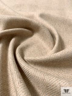 a close up view of a beige fabric