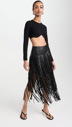 Elegant Fringe Bottoms For Evening, Fitted Fringe Bottoms For Evening, Evening Skirt With Fringe For Spring, Chic Fringe Skirt For Night Out, Chic Skirt With Tassels For Night Out, Black Tasseled Skirt For Spring, Spring Evening Skirt With Fringe, Chic Tassel Skirt For Night Out, Elegant Fringe Skirt For Evening