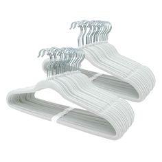 three white plastic hangers on a white background