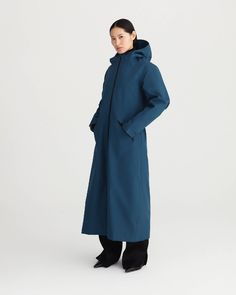 SPIRIT offers a distinctive look, alongside protection, empowering and complementing a woman’s shape. It is a long all-weather coat with recycled detachable liner. DESCRIPTIONA 3-in-1 raincoat, the recycled polyester lining performs as a standalone coat in itself.The outer coat alone makes for the perfect waterproof mid-season and summer protection.Both coats combined offer the perfect all-weather protection.Falling just above the ankles, the hem can be cinched to create the perfect silhouette.T Raincoat Outfit, Ethical Clothing Brands, Long Winter Coats, Waterproof Coat, Blue Rain, Ethical Clothing, Woman Silhouette, Rain Wear, Coat Fashion