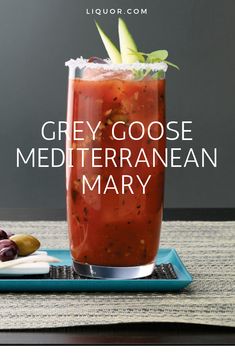 the grey goose mediterranean mary is served in a tall glass with garnishes