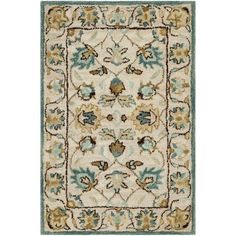 a rug with an ornate design on the front and back side, in beige and blue colors