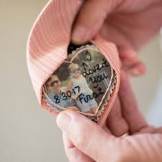 someone is holding a heart shaped photo with words on it