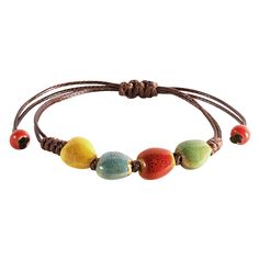 PRICES MAY VARY. VIBRANT HANDCRAFTED CERAMIC BEADS: Each bead on this bohemian bracelet is crafted from ceramic and uniquely colored, offering a vibrant spectrum from earthy greens to sunny yellows, making it a standout accessory. ADJUSTABLE LEATHER CORD: The robust leather cord is designed for longevity and comfort, featuring an adjustable knot that allows for a customized fit for any wrist size. PERFECT FOR LAYERING OR SOLO WEAR: Whether worn alone for a subtle hint of color or layered with ot Colorful Adjustable Bohemian Beaded Bracelets, Adjustable Colorful Bohemian Beaded Bracelets, Casual Multicolor Jewelry With Adjustable Length, Bohemian Brown Bracelets For Vacation, Colorful Bohemian Beaded Bracelets For Vacation, Bohemian Colorful Beaded Bracelets For Vacation, Bohemian Multicolor Friendship Bracelets For Vacation, Colorful Bohemian Friendship Bracelets, Colorful Casual Jewelry For Festival