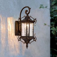 an old fashioned wall light on the side of a building