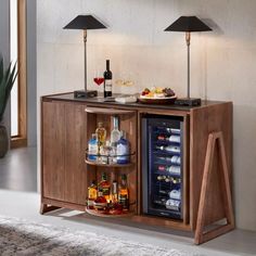 a wooden cabinet with two shelves holding bottles and drinks